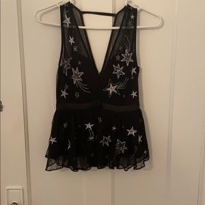 Black going out top with stars and gems.